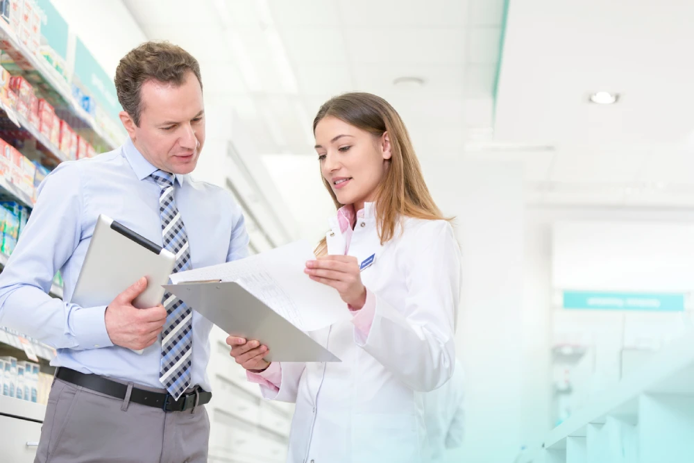 pharmacy owner talking to a pharmacist