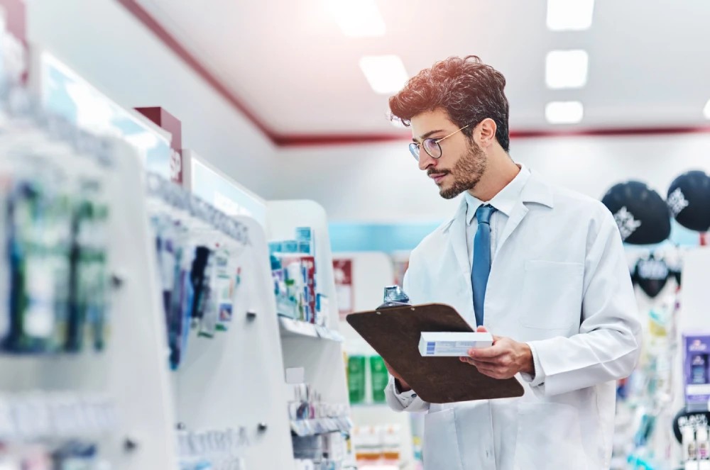 pharmacist taking inventory for accurate pharmacy business management