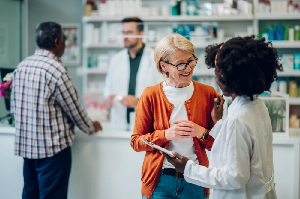 pharmacy franchise owner talking to patient