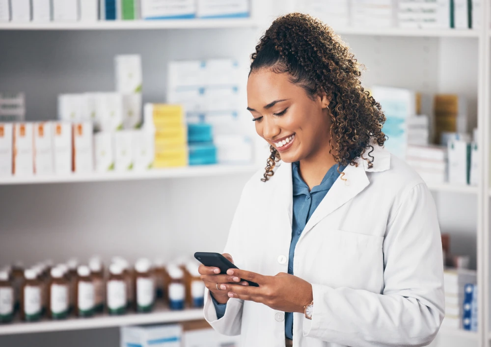 pharmacist looking at her phone