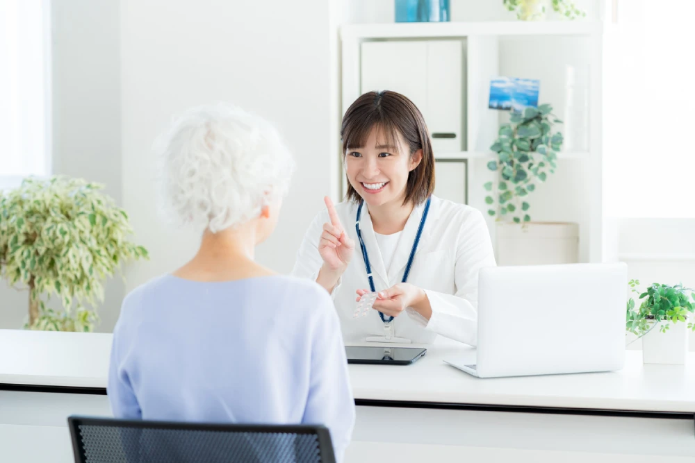woman talking to pharmacist at a pharmacy care clinic