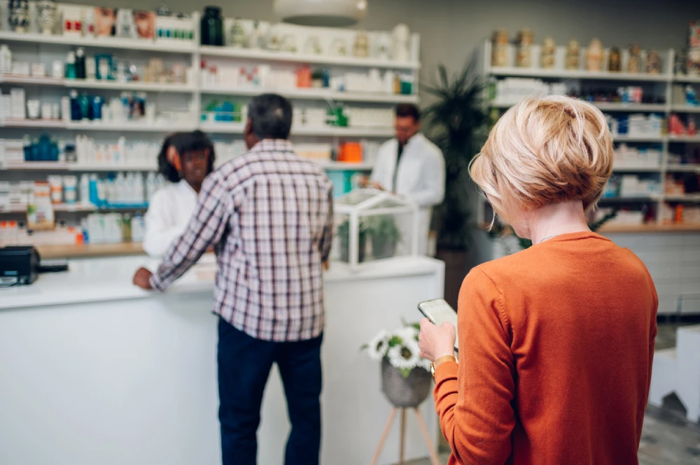 person standing in line at a local pharmacy location