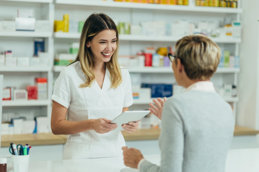 pharmacy technician talking to a patient