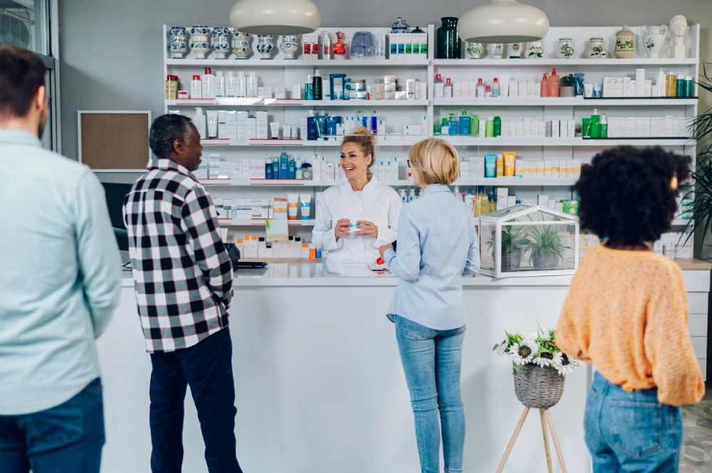 pharmacist supporting customers - staying ahead of pharmacy competition